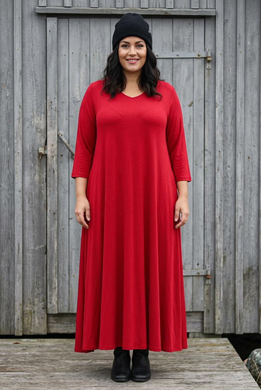 Ny mörkhårig modell med makeup och klarröd maxi utan slits